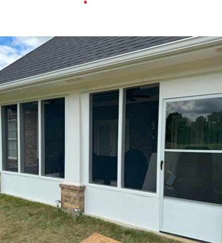 Recent screened porch addition with professional white framing and large screen panels